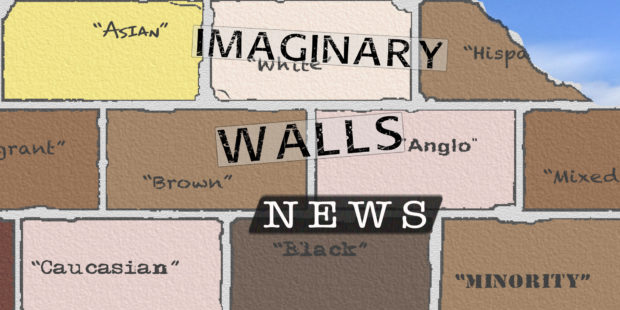 A brick wall with racialized names on it, such as "Angle," "Brown," "Hispanic"